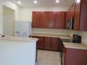 Kitchen with plenty of cabinet space, white appliances, and lots of countertop area at 318 Habitat Way, Sanford, FL 32773