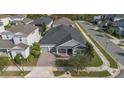 Aerial view of a well-maintained home in a peaceful neighborhood with lush landscaping and a private driveway at 4789 Terrace Bluff St, Winter Garden, FL 34787