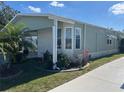 Charming home exterior featuring well-manicured landscaping, stone accents, and a clean, modern design at 723 Polo Park East Blvd, Davenport, FL 33897