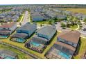 Aerial view of several homes with screened-in pools in a residential neighborhood at 1731 Caribbean View Ter, Kissimmee, FL 34747