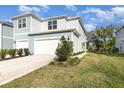 Beautiful two-story home with a well-manicured lawn at 2623 Buena View Rd, Kissimmee, FL 34746