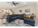 Living room featuring a sectional sofa, side tables and decor at 2623 Buena View Rd, Kissimmee, FL 34746