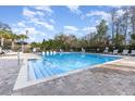 Large swimming pool features clear water and lounge chairs, perfect for relaxation and enjoyment at 2623 Buena View Rd, Kissimmee, FL 34746