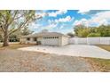 Attached two-car garage with ample parking on a paved driveway at 345 Overstreet Ave, Longwood, FL 32750