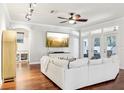 Cozy living room featuring wood floors and plenty of natural light at 583 Treehouse St, Winter Springs, FL 32708