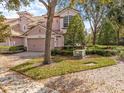 Charming two-story home featuring a brick driveway and well-maintained landscaping at 1431 Milledge Ln, Davenport, FL 33896