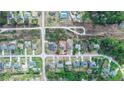 An aerial view shows the home's location in the neighborhood at 2645 Coachman Dr, Deltona, FL 32738