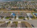 Aerial view of a residential neighborhood showcasing similar single Gathering homes at 337 Regency Ridge Dr, Davenport, FL 33837