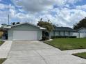 Charming single-story home with a well-maintained lawn, attached garage, and classic curb appeal at 3807 March Ave, Orlando, FL 32806