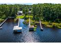 Scenic aerial view of waterfront homes with docks and serene water views at 13344 S Lake Mary Jane Rd, Orlando, FL 32832