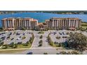 Stunning aerial view of a lakefront condo community with ample parking at 16300 County Road 455 # 305, Montverde, FL 34756