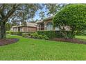 Beautiful landscaping surrounds this well-maintained home at 1921 Redwood Grove, Lake Mary, FL 32746