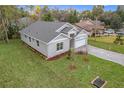 Well-manicured lawn and modern exterior highlight this charming one-story single Gathering home at 340 Bahia Cir, Longwood, FL 32750