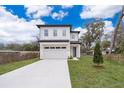 New two-story home features a two-car garage and modern architectural design at 39 N Sunset Dr, Casselberry, FL 32707