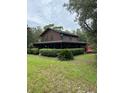 Lovely two-story home features a wrap-around porch and mature landscaping at 40201 Jericho Trl, Eustis, FL 32736