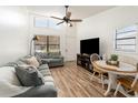 Bright living room with vaulted ceilings, lots of natural light, wood flooring and comfortable seating at 537 Martin Place Blvd, Apopka, FL 32712