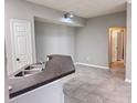 Kitchen view includes a stainless steel sink, tile floors, gray walls, and bright lighting at 6408 Raleigh St # 2402, Orlando, FL 32835