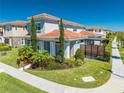 Attractive home with a red tile roof and meticulously landscaped front yard at 9406 Mere Pkwy, Orlando, FL 32832