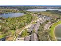 Aerial view of neighborhood featuring community lakes and manicured landscaping at 14143 Ancilla Blvd, Windermere, FL 34786