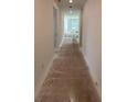 Unfinished long hallway, offering a view of the house's interior and natural light at 1453 Arbor Hill Dr, Deltona, FL 32725