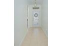 Inviting hallway with tiled floors leading to an elegant front door with decorative glass at 1660 Mountclair Ct, Mount Dora, FL 32757