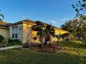 Charming single-story home with landscaped garden and well-maintained lawn at 229 Silverton Rd, Davenport, FL 33897