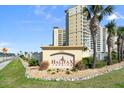 Halifax Landing condos with beautifully landscaped entrance and clear signage at 2801 S Ridgewood Ave # 1412, South Daytona, FL 32119