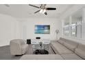 Bright and airy living room with modern furnishings and a wall-mounted television at 2993 Irish Peach Dr, Winter Garden, FL 34787