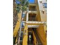 Inviting condo exterior with stairs, balconies, and a well-maintained facade in a desirable community at 3338 Robert Trent Jones Dr # 20804, Orlando, FL 32835