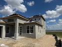 Exterior view of a two-story home under construction near the lake at 336 Caladium Ave, Lake Alfred, FL 33850