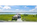 Beautiful waterfront property with lush green surroundings and modern architectural design at 336 Caladium Ave, Lake Alfred, FL 33850