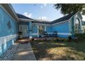 Inviting front porch with chairs and a garden, creating a welcoming outdoor space at 4523 Saddle Creek Pl, Orlando, FL 32829