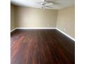 Bedroom features stunning dark wood floors and a ceiling fan at 516 Orange Dr # 17, Altamonte Springs, FL 32701