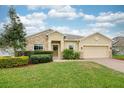 Charming single-story home with manicured lawn, stone accents, and a welcoming front entrance at 636 Bainbridge Loop, Winter Garden, FL 34787