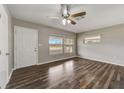 Inviting living room featuring stylish wood floors, neutral paint, and ample natural light at 812 Oleander St, New Smyrna Beach, FL 32168