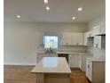 Open-concept kitchen with quartz countertops and island with stainless steel appliances at 950 20Th St, Orlando, FL 32805