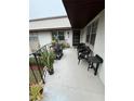 Relax on your private balcony with chairs and plenty of space for plants at 96 Windtree Ln # 203, Winter Garden, FL 34787