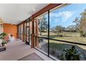 Relaxing screened porch with a view of the yard at 1031 Kings Hwy, Kissimmee, FL 34744