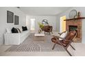 Bright living room featuring a fireplace, stylish furniture, and minimalist decor at 1232 Corbett Ln, Orlando, FL 32806
