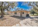 Charming single-story home featuring a well-maintained lawn and a cozy front entrance at 203 North E Blvd, Davenport, FL 33837