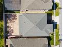An aerial view showcasing the home's roof, backyard, and proximity to neighboring houses and streets at 2600 Avian Loop, Kissimmee, FL 34741