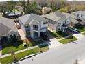 An aerial view of a well-maintained neighborhood showcasing the home's proximity to other residences at 2600 Avian Loop, Kissimmee, FL 34741