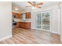 Bright kitchen featuring stainless steel appliances, wood cabinets, and sliding glass doors to a well-kept yard at 3675 Rundo Dr, Orlando, FL 32818