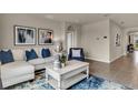 Inviting living room showcasing modern furnishings and decor with a neutral color palette and tile flooring at 3751 Bluethread Way, Poinciana, FL 34759