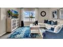 Cozy living room with bright natural light, stylish furnishings, and modern decor at 3751 Bluethread Way, Poinciana, FL 34759