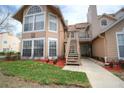 Inviting two-story condo with well-maintained landscaping and a charming entrance staircase at 634 Steamboat Ct # 171, Altamonte Springs, FL 32714
