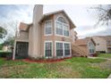 Inviting exterior of a two-story condo with updated features and a screened porch on the second story at 634 Steamboat Ct # 171, Altamonte Springs, FL 32714