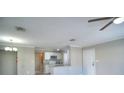 Open-concept kitchen featuring modern appliances, granite countertops, and a breakfast bar at 634 Steamboat Ct # 171, Altamonte Springs, FL 32714