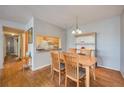 Cozy dining area with a wooden table set, adjacent to the kitchen, great for Gathering meals at 8215 Sun Spring Cir # 32, Orlando, FL 32825