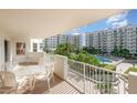 Relax on the balcony overlooking the community pool and manicured landscaping with seating at 1 John Anderson Dr # 317, Ormond Beach, FL 32176